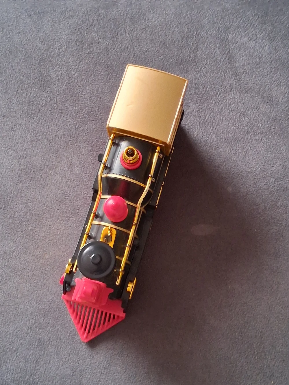 Vintage Style Black and Gold Toy Train with Red Accents